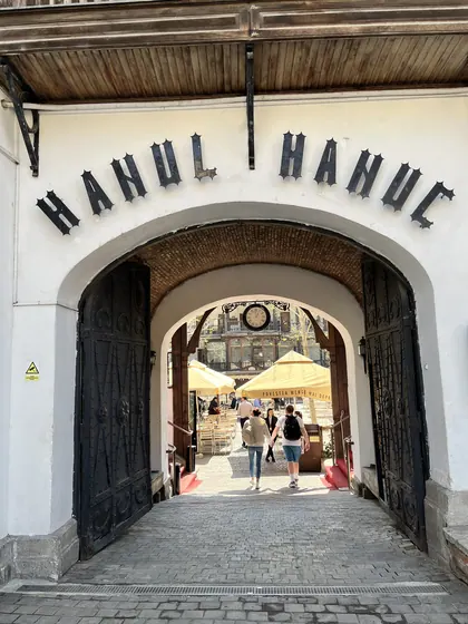 The arched entrance to Hanu’ lui Manuc, opening onto its courtyard.