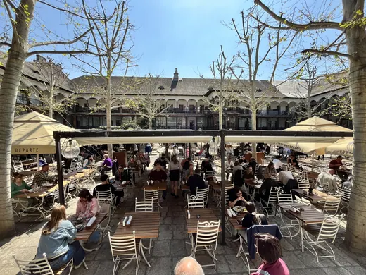 View across the dining courtyard towards Hanu’ lui Manuc’s upper wooden galleries.