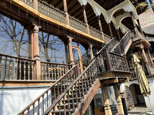 Carved timber galleries, staircase and balconies at Hanu’ lui Manuc.