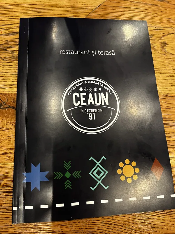 Restaurant Ceaun menu cover with the words ‘în cartier din ’91’.