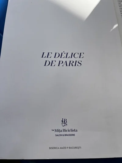 La Mița Biciclista menu cover bearing the words Le Délice de Paris