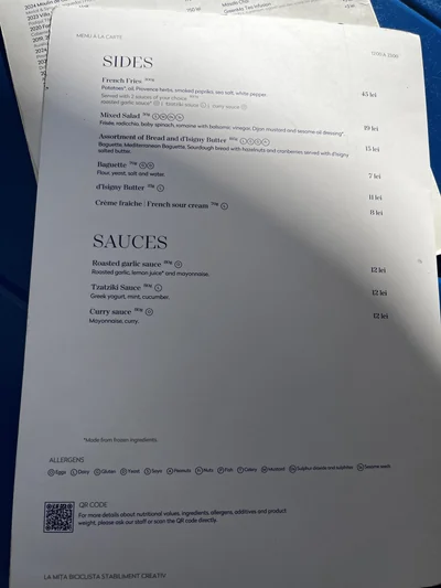Printed menu listing side dishes and sauces at La Mița Biciclista