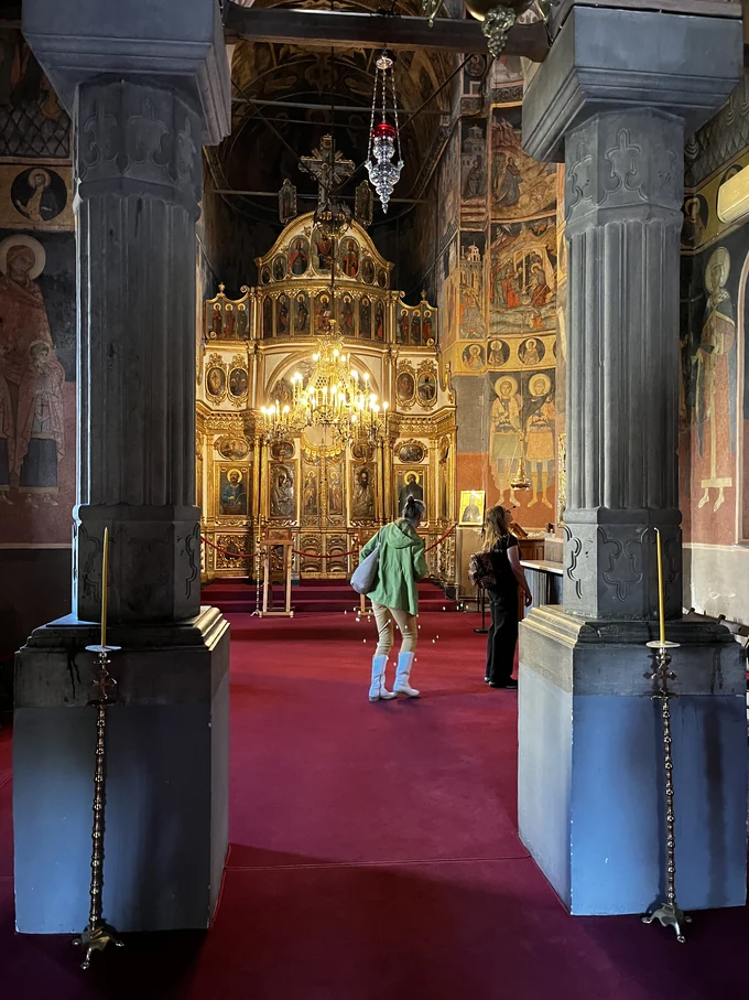 View down the nave toward the gilded iconostasis at Kretzulescu Church.