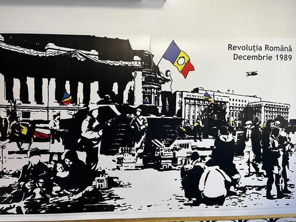 Illustrated crowd scene labelled Romanian Revolution December 1989.