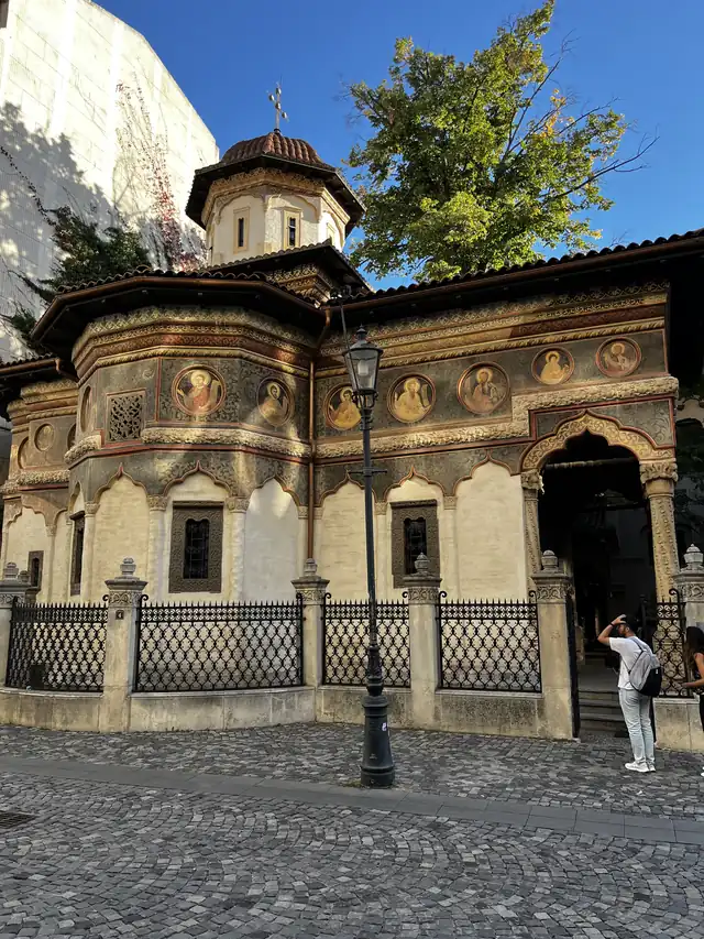 Painted saints’ medallions and stone carvings on the façade of Stavropoleos Church.