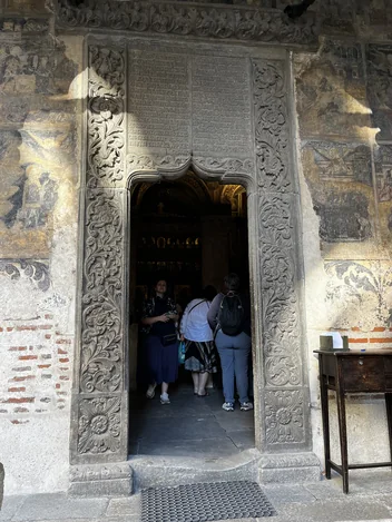Carved stone entrance frame at Stavropoleos Church in Bucharest.