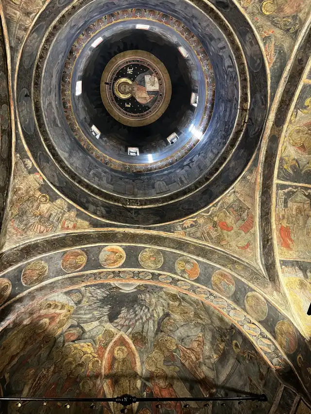 Painted dome and arches viewed from inside Stavropoleos Church.